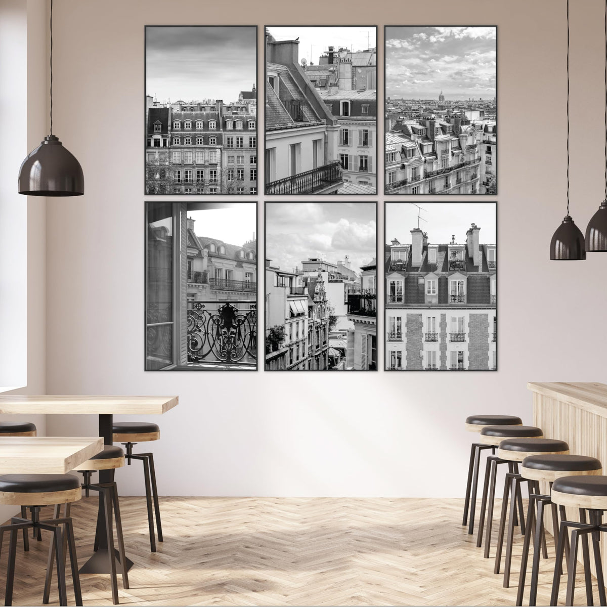 Modern interior with wall art depicting cityscapes and dining area.