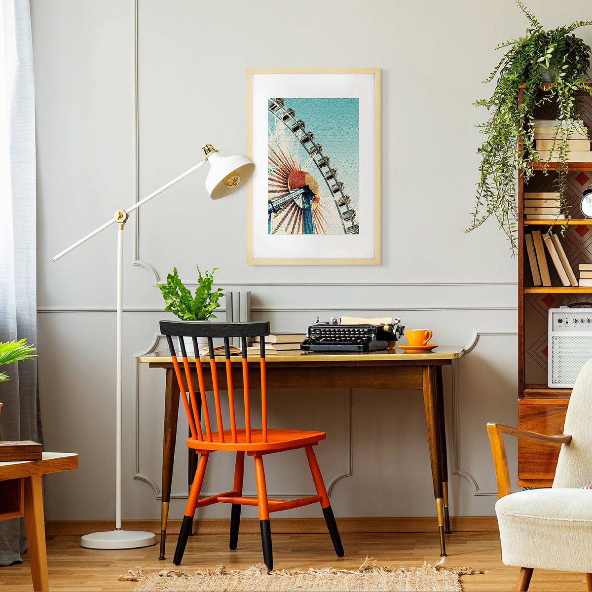 Modern home office with a desk, chair, lamp, and decor elements.