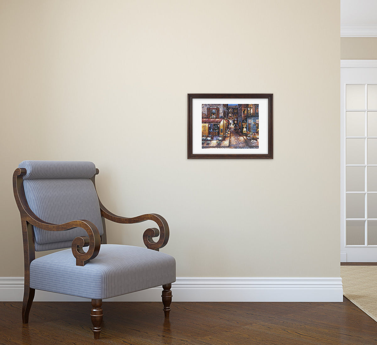 Chair with wooden armrests and a framed picture on a beige wall.