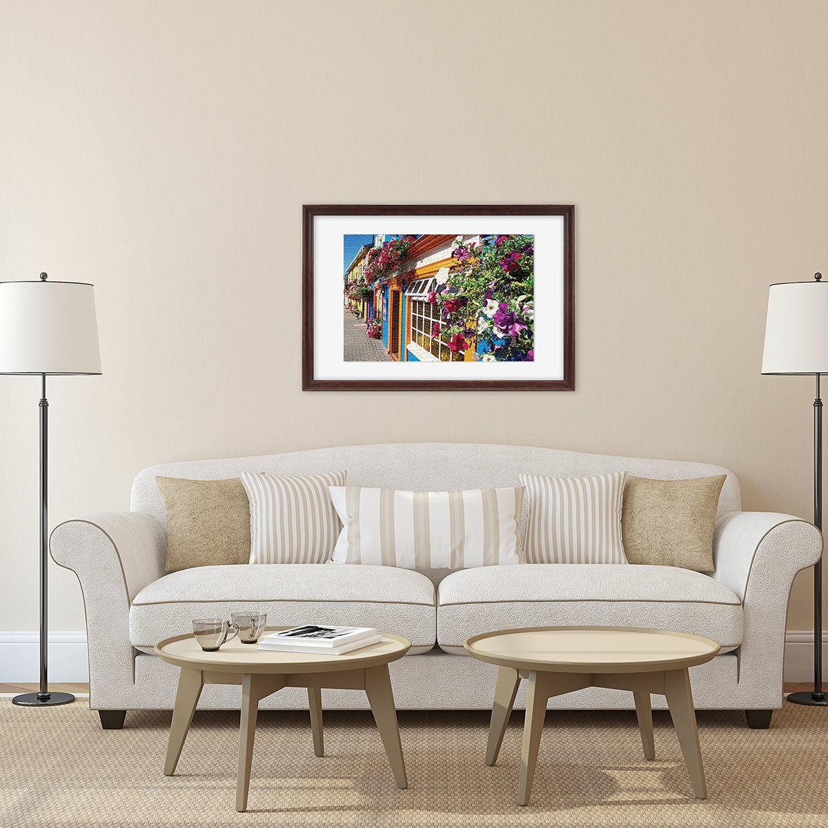 Living room with a beige sofa, two lamps, and a framed picture on the wall.